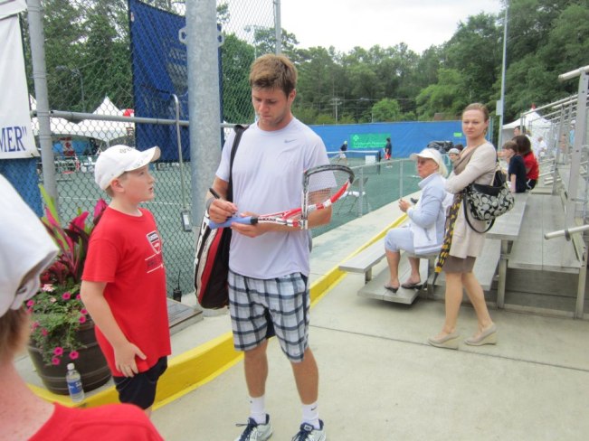 Photo Retweeted by Ben Rothenburg of Harrison Signing Busted Racquet for the Fan who Snagged It. (Now Famous)