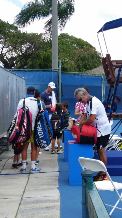 Sam Querrey signs for fans in Delray