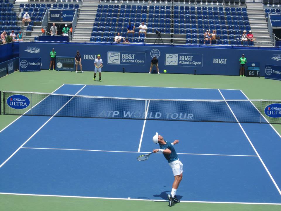 Johnson serving against Lacko